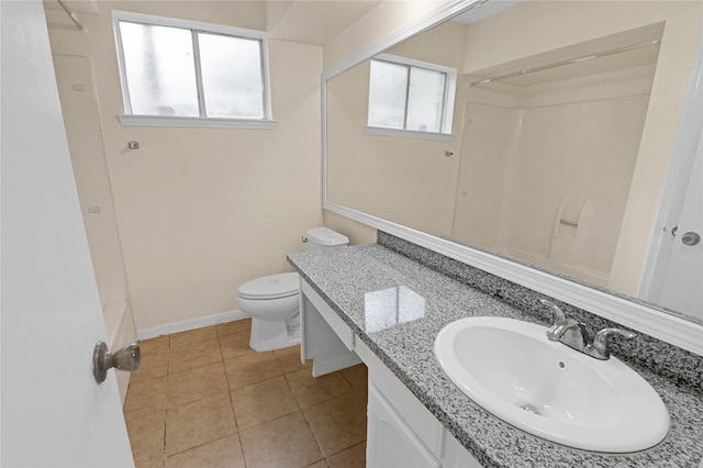 10211 Golden Meadow Dr, Houston, TX 77064 - bathroom featuring vanity, toilet, tile patterned floors, and baseboards