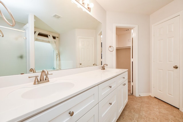 21126 N Yellow Bud Ct, Cypress, TX 77433 - bathroom with double vanity, a shower with door, a closet, and tile patterned floors