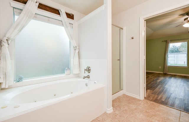 21126 N Yellow Bud Ct, Cypress, TX 77433 - full bath with a tub with jets, a ceiling fan, a stall shower, tile patterned flooring, and baseboards