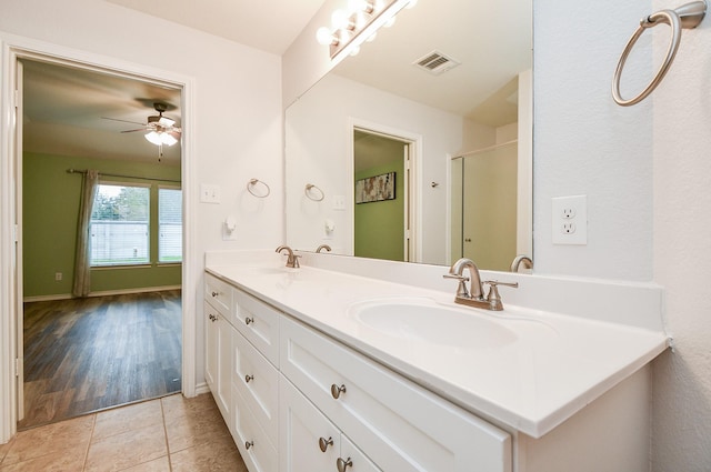 21126 N Yellow Bud Ct, Cypress, TX 77433 - full bathroom featuring double vanity, ceiling fan, and tile patterned flooring