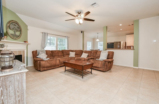21126 N Yellow Bud Ct, Cypress, TX 77433 - living room with ceiling fan, a fireplace, light tile patterned floors, recessed lighting, and baseboards