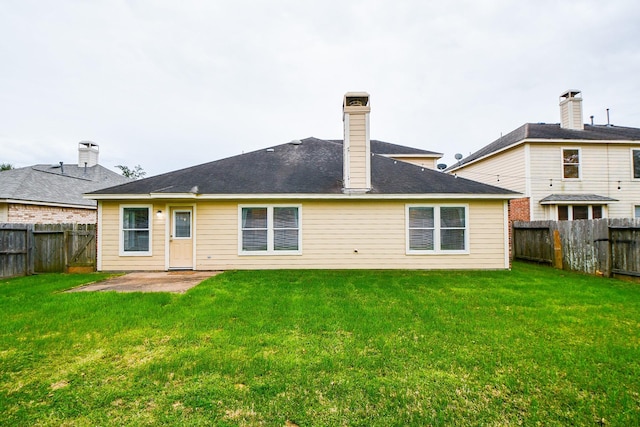 21126 N Yellow Bud Ct, Cypress, TX 77433 - back of property featuring a patio area and a chimney