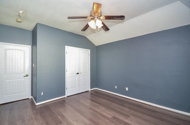 17719 Creek Bluff Ln, Cypress, TX 77433 - unfurnished bedroom with baseboards, wood finished floors, lofted ceiling, a closet, and a ceiling fan