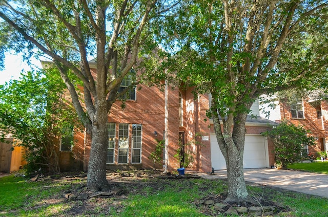 17719 Creek Bluff Ln, Cypress, TX 77433 - view of front facade with concrete driveway, a garage, and brick siding