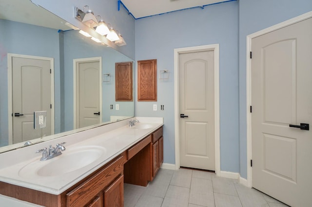 17719 Creek Bluff Ln, Cypress, TX 77433 - full bathroom with double vanity, baseboards, and tile patterned floors