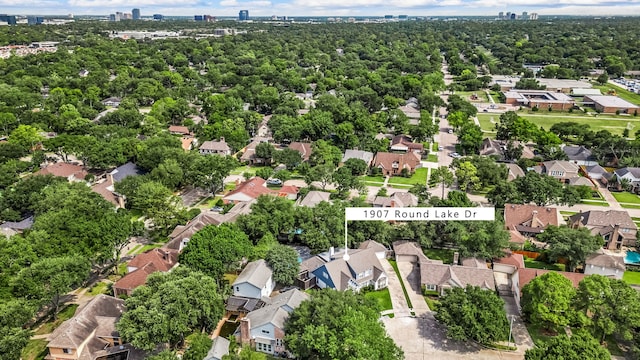 1907 Round Lake Dr, Houston, TX 77077 - aerial view of property and surrounding area with nearby suburban area and city skyline