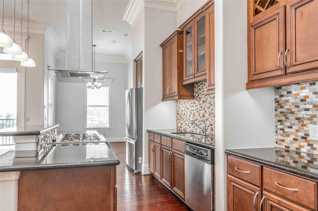 2510 Travis St Unit 301, Houston, TX 77006 - kitchen featuring appliances with stainless steel finishes, a sink, brown cabinetry, plenty of natural light, and ornamental molding
