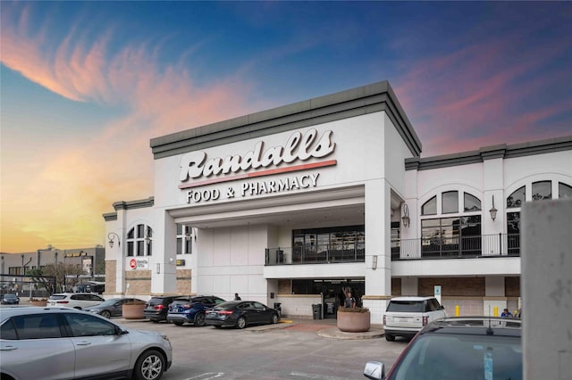 2510 Travis St Unit 301, Houston, TX 77006 - property at dusk featuring uncovered parking and view of commercial area