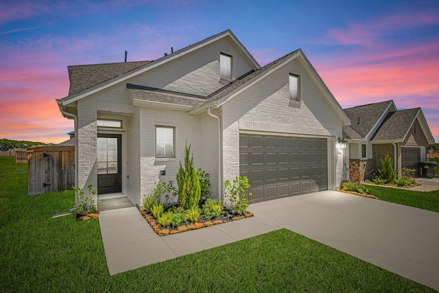 19253 Hazel Firs Ct, Magnolia, TX 77355 - view of front of home with an attached garage, driveway, brick siding, a front yard, and roof with shingles