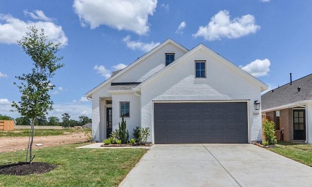19253 Hazel Firs Ct, Magnolia, TX 77355 - view of front of property with concrete driveway, an attached garage, and a front yard