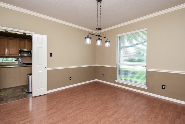 17619 Rustling Aspen Ln, Houston, TX 77095 - unfurnished dining area with crown molding and wood finished floors
