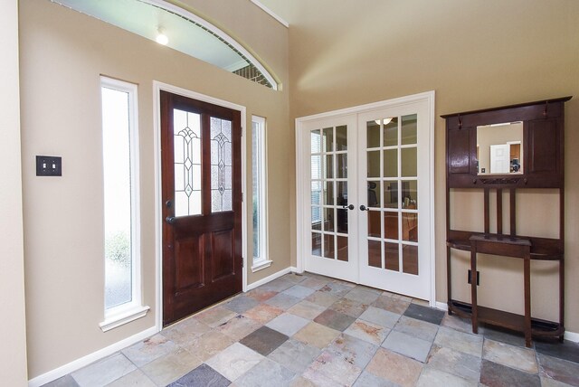 17619 Rustling Aspen Ln, Houston, TX 77095 - foyer featuring french doors and stone finish flooring