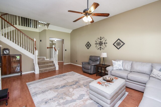 17619 Rustling Aspen Ln, Houston, TX 77095 - living area featuring a ceiling fan, stairway, wood finished floors, and lofted ceiling