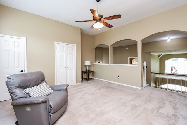 17619 Rustling Aspen Ln, Houston, TX 77095 - living area with a ceiling fan, carpet, and arched walkways