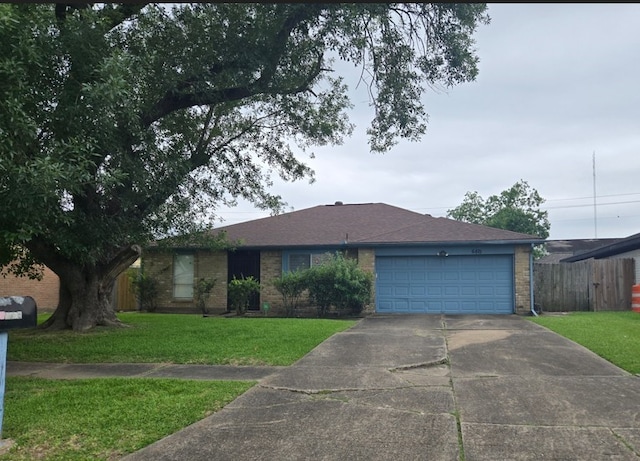 6815 Maczali Dr, Houston, TX 77489 - ranch-style home with driveway, brick siding, a garage, and roof with shingles