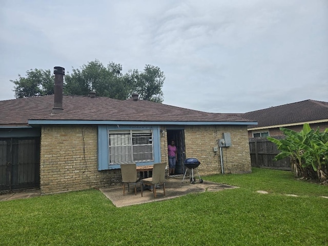 6815 Maczali Dr, Houston, TX 77489 - back of house featuring a patio, roof with shingles, and brick siding