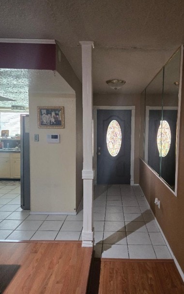6815 Maczali Dr, Houston, TX 77489 - corridor featuring light tile patterned flooring and decorative columns
