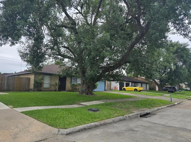 6815 Maczali Dr, Houston, TX 77489 - view of front of home featuring asphalt driveway and a garage