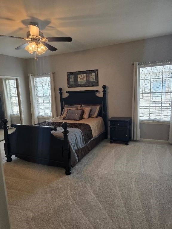 334 Wilcrest Dr Unit 334, Houston, TX 77042 - bedroom with light carpet and a ceiling fan
