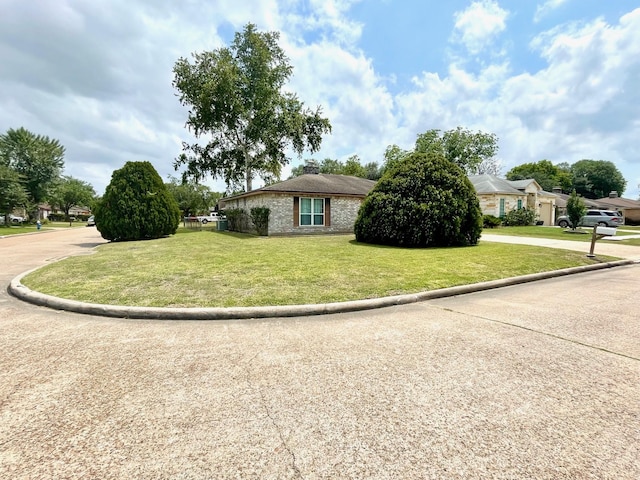 13011 Harwin Dr, Houston, TX 77072 - view of front of home with a front yard and a chimney