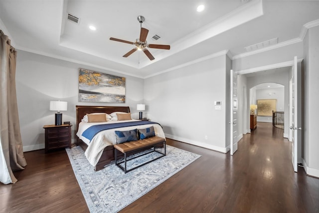 1746 Du Barry Ln, Houston, TX 77018 - bedroom with a raised ceiling, arched walkways, dark wood-style floors, baseboards, and ornamental molding