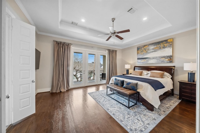 1746 Du Barry Ln, Houston, TX 77018 - bedroom featuring a tray ceiling, access to exterior, french doors, wood finished floors, and recessed lighting