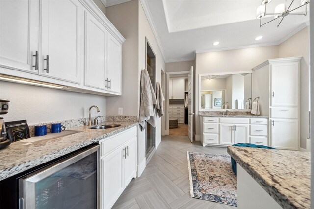 1746 Du Barry Ln, Houston, TX 77018 - bar area with wine cooler, a sink, ornamental molding, a chandelier, and recessed lighting