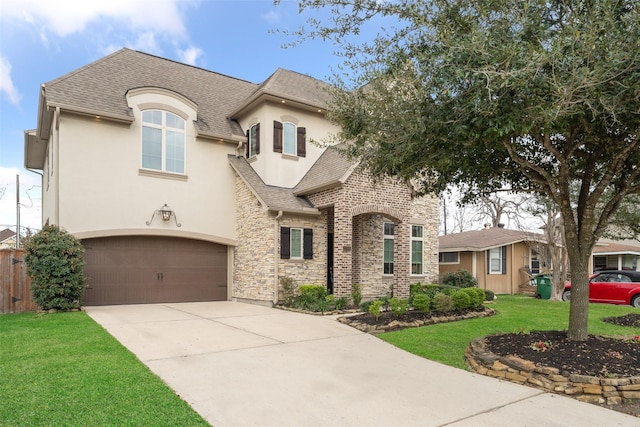 1746 Du Barry Ln, Houston, TX 77018 - french country inspired facade with stucco siding, a shingled roof, stone siding, concrete driveway, and a front yard
