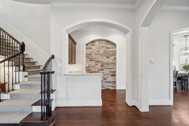 1746 Du Barry Ln, Houston, TX 77018 - entrance foyer featuring dark wood-style floors, stairs, crown molding, arched walkways, and baseboards