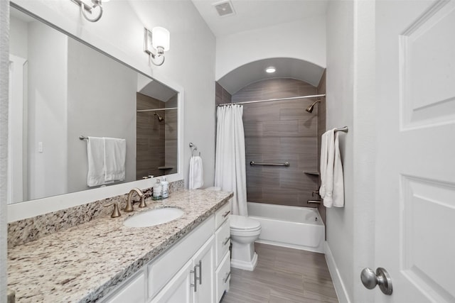 1746 Du Barry Ln, Houston, TX 77018 - full bath featuring vanity, toilet, shower / tub combo with curtain, and baseboards