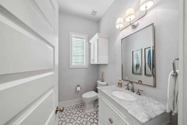 1746 Du Barry Ln, Houston, TX 77018 - bathroom with vanity, toilet, and baseboards