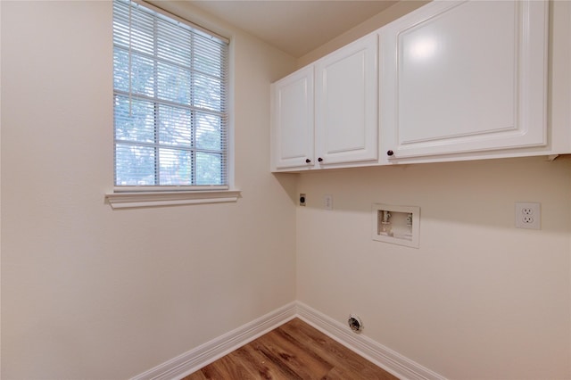 16727 Camber Ct, Crosby, TX 77532 - laundry area with electric dryer hookup, cabinet space, washer hookup, baseboards, and wood finished floors