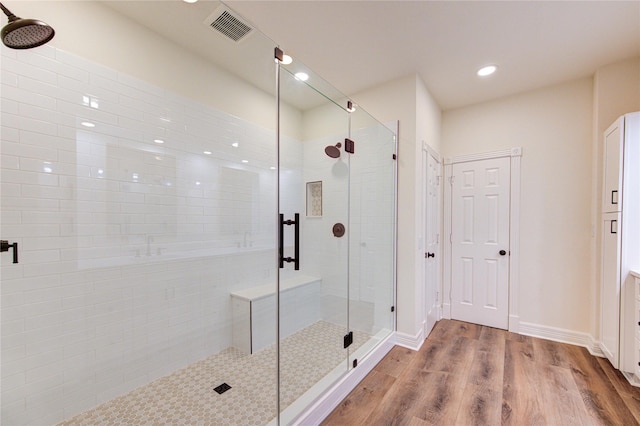 16727 Camber Ct, Crosby, TX 77532 - bathroom featuring a stall shower, wood finished floors, and recessed lighting