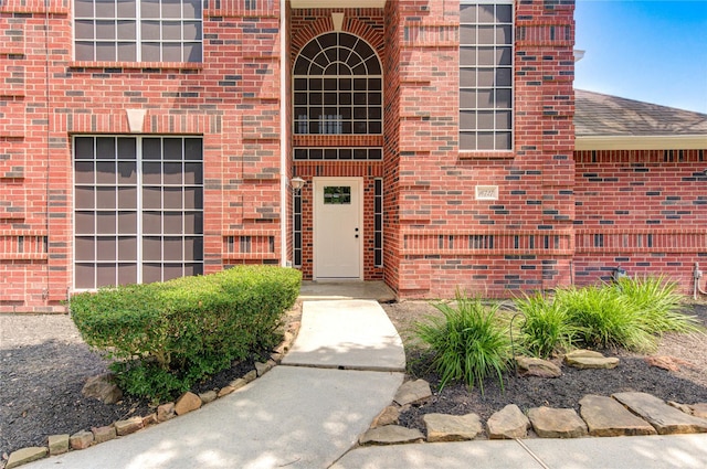 16727 Camber Ct, Crosby, TX 77532 - property entrance featuring brick siding and roof with shingles