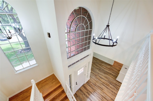 16727 Camber Ct, Crosby, TX 77532 - foyer with a chandelier, wood finished floors, baseboards, and a towering ceiling