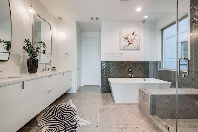 1851 Sul Ross St, Houston, TX 77098 - full bath featuring a freestanding bath, double vanity, a stall shower, and recessed lighting