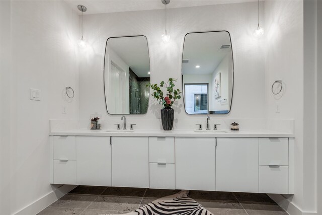 1851 Sul Ross St, Houston, TX 77098 - bathroom featuring double vanity and baseboards