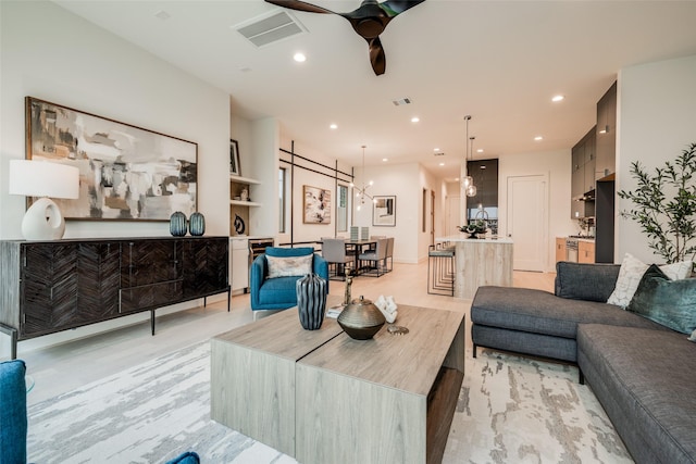1851 Sul Ross St, Houston, TX 77098 - living room with a ceiling fan, light wood finished floors, and recessed lighting