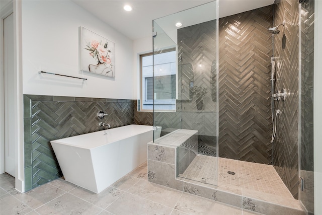 1851 Sul Ross St, Houston, TX 77098 - bathroom with a soaking tub, a stall shower, and tile walls