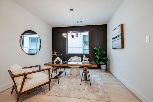 1851 Sul Ross St, Houston, TX 77098 - office area featuring light wood finished floors, a chandelier, and baseboards