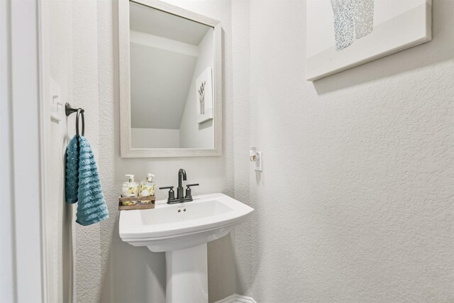 19303 Belmont Stakes Way, Tomball, TX 77377 - bathroom featuring a textured wall and a sink