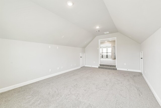 19303 Belmont Stakes Way, Tomball, TX 77377 - additional living space with carpet flooring, vaulted ceiling, baseboards, and recessed lighting