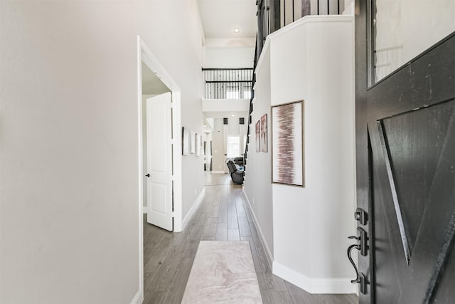 19303 Belmont Stakes Way, Tomball, TX 77377 - foyer featuring baseboards, wood finished floors, and a high ceiling