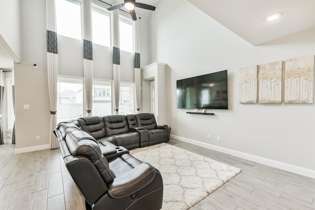 19303 Belmont Stakes Way, Tomball, TX 77377 - living room with high vaulted ceiling, healthy amount of natural light, a ceiling fan, and light wood-style floors