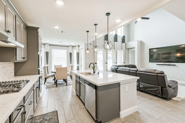 19303 Belmont Stakes Way, Tomball, TX 77377 - kitchen featuring a sink, appliances with stainless steel finishes, gray cabinets, open floor plan, and recessed lighting