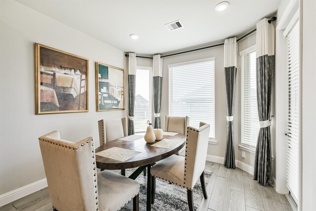 19303 Belmont Stakes Way, Tomball, TX 77377 - dining space featuring baseboards, plenty of natural light, light wood finished floors, and recessed lighting