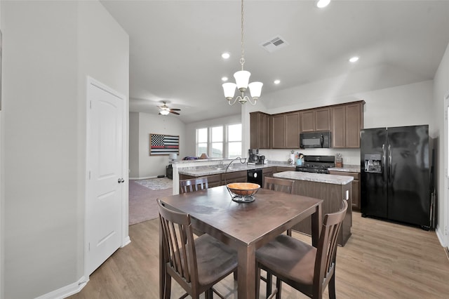 13999 Katlin Rd, Conroe, TX 77306 - dining space with lofted ceiling, recessed lighting, light wood-style floors, baseboards, and a chandelier