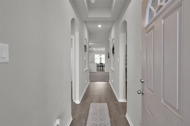 13999 Katlin Rd, Conroe, TX 77306 - corridor featuring dark wood-style flooring, baseboards, arched walkways, and recessed lighting