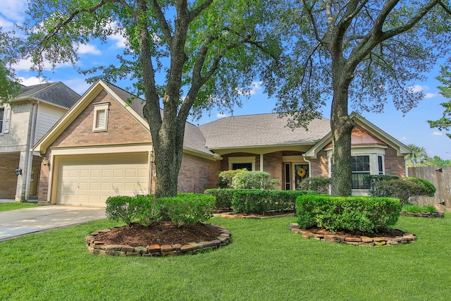 9515 Willow Crossing Dr, Houston, TX 77064 - view of front of house with brick siding, driveway, a garage, and roof with shingles