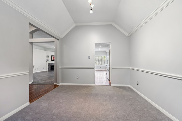 9515 Willow Crossing Dr, Houston, TX 77064 - spare room with carpet flooring, lofted ceiling, baseboards, a tile fireplace, and crown molding